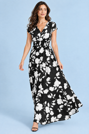 Robe longue noire à fleurs et taille smockée | Vue en mouvement | Lounelle Paris
